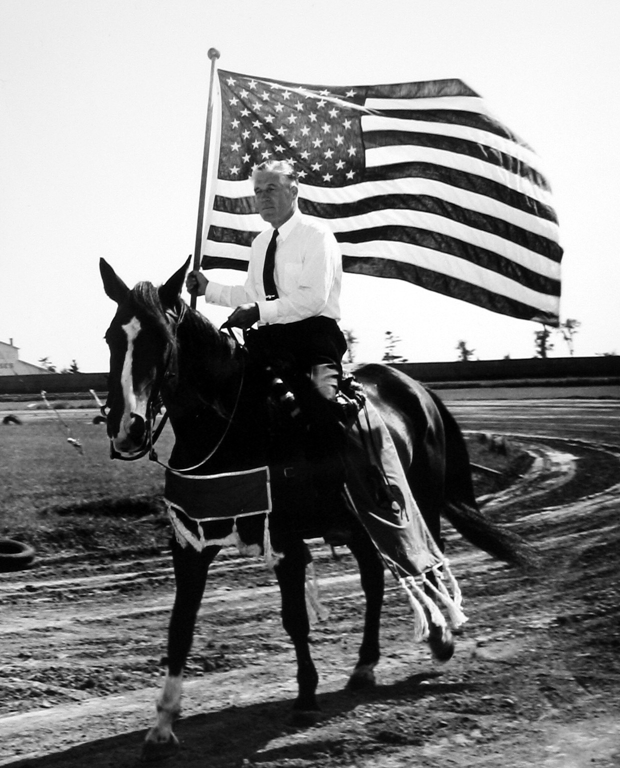 <img src="George Romney.jpg" alt="Romney American flag" />