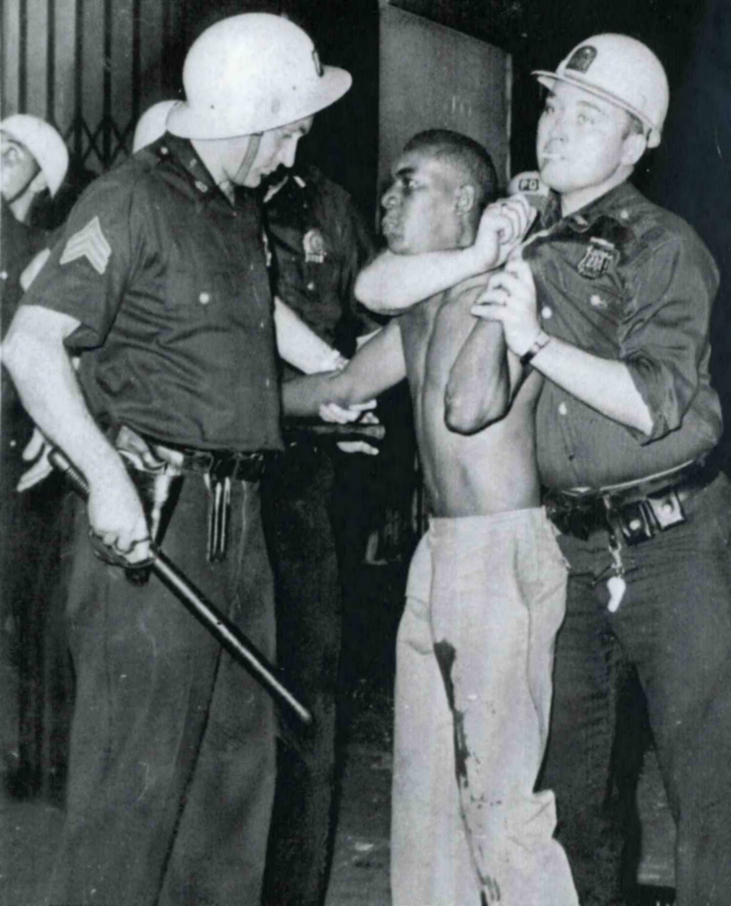 Police restrain prisoner Harlem riot 1964
