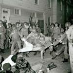 SNCC photographer attempts to take a photo and is mauled by the Guardsmen. 