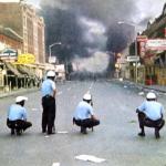 Still adhering to the no-shoot order, Detroit police watch in disgust as rioters’ loot and burn their way unabated down 12th Street.   