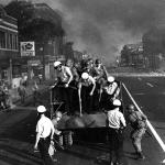 
Detroit police, in tandem with their Guardsmen comrades, enter the cauldron of Linwood Avenue, embers raining down on officers and rioters alike. 