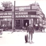 With little left to take, a looter satisfies himself with a tire from the ransacked Paradise Loans store. 