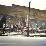 Neighborhood kids, all sporting new bicycles, examine the wreckage of an A & P supermarket.